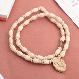 Sacred Tulsi round beads mala with a beautifully crafted Radha pendant, inspired by the devotion of ISKCON Sri Sri Radha Rasabihari Temple, traditionally used for chanting, meditation, and spiritual protection. India’s Premium Jap Mala Store- www.japay.in

